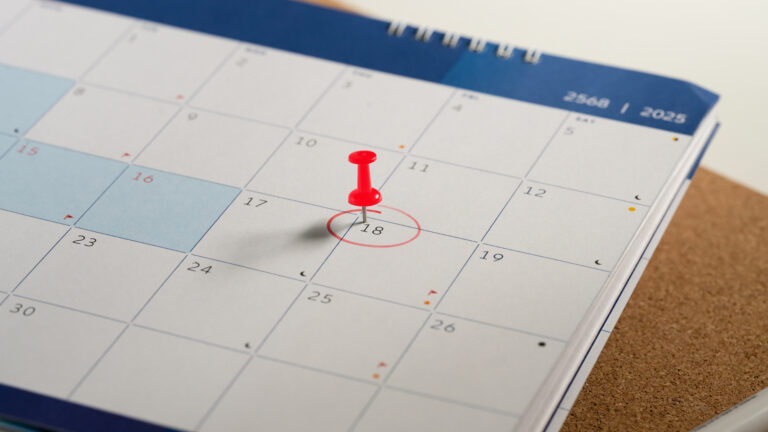 Close up of calendar with the 18th circled in red, showing the due date for the next car service to maintain your Second-Hand Car