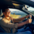 A middle-aged man driving a new vehicle to a destination near Joburg